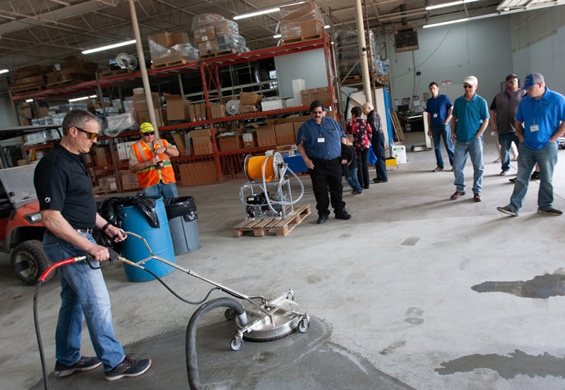 Mike Teaching Students how to use pressure washing equipment in class